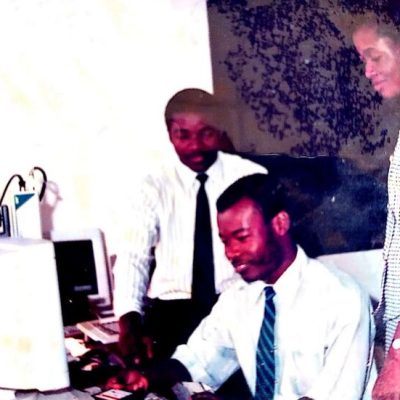 Mr. Niyi Yusuf training a male and female staff member