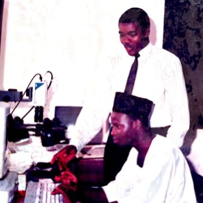 Mr. Niyi Yusuf training a male staff member